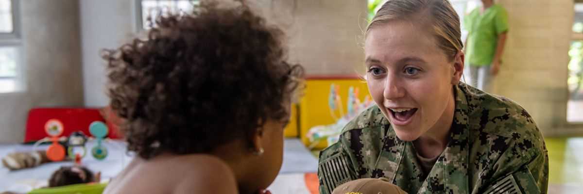 Navy service member working in classroom