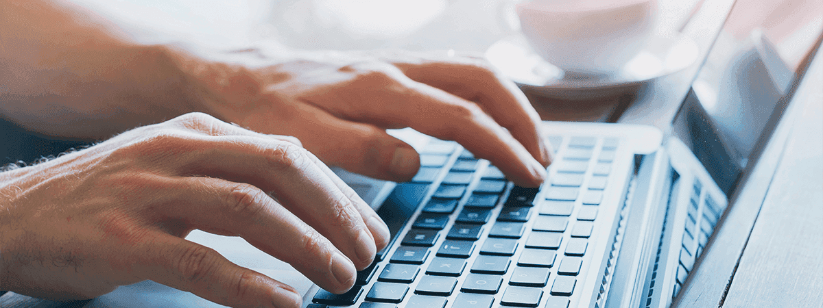 person typing on keyboard